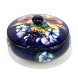 MOORCROFT; a frilled 'Lily' pattern circular box and cover, impressed marks and impressed signature,