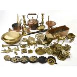 A quantity of mixed brass and metalware to include brass candlesticks, copper pans, a copper kettle,