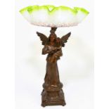 A late 19th/early 20th century bronzed spelter centrepiece with a green and vaseline glass bowl with