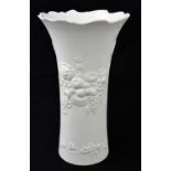 KAISER; a vase moulded with flowers and fruit, height 28.5cm.Condition Report: Good condition.