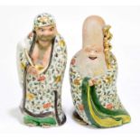 A pair of Japanese ceramic figures of Immortals, height 24cm (2).