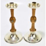 ALBERT EDWARD JONES; a pair of Arts & Crafts silver plated oak candlesticks, height 25cm.Condition