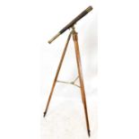 KELVIN AND HUGHES (MARINE LTD); a brass and leather telescope, on wooden tripod stand.Condition