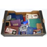 A collection of British and world coins, in presentation packs, cases and loose, to include a 1970