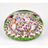 ST LOUIS; a 19th century Millefiori paperweight, later faceted, diameter 7cm.Condition Report: The