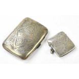 JOSEPH GLOSTER LTD; an Edward VII hallmarked silver cigarette case of shaped rectangular form with