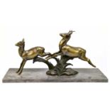 A SOLCAU; a bronze figure of leaping doe and stag, on marble plinth base, signed, height 40cm.