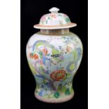 A Chinese Famille Rose vase and cover, decorated with flowers, rock work and birds, height 42cm.