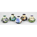 MOORCROFT; five miniature baluster shaped vases, each with floral decoration, impressed marks to the