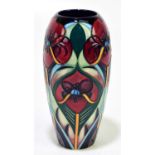 RACHEL BISHOP FOR MOORCROFT; a vase deorated with stylised flowers against a green goround, height