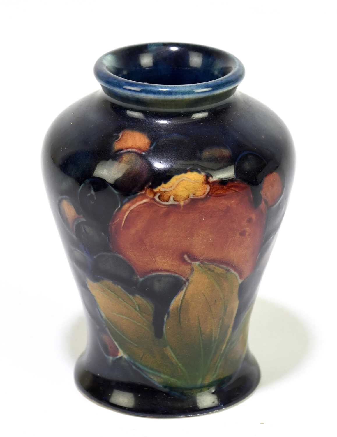 MOORCROFT; a small 'Pomegranate' pattern vase, impressed marks and impressed signature, height 8.