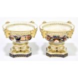DERBY; a pair of 19th century pot pourris decorated in the Imari palette, applied and gilt with four