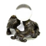 A Japanese bronze group of three dogs in a circle, diameter 6cm.