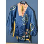 A late 19th/early 20th century Chinese floral embroidered blue silk waist length coat.