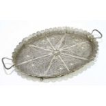 A Persian white metal filigree twin handled gallery tray, with pierced scrolling decoration,