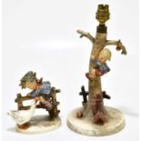 GOEBELS; a Hummel table lamp representing a dog barking at a boy climbing a tree, height 30cm,