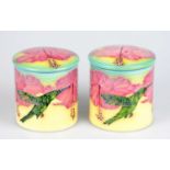 SALLY TUFFIN FOR DENNIS CHINAWORKS; a pair of limited edition jars and covers of cylindrical form,