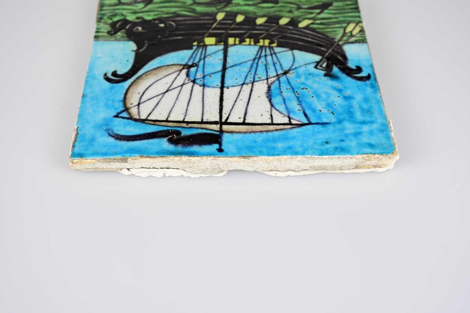 WILLIAM DE MORGAN; an Art Pottery tile painted with a galleon ship with six sailors with paddles - Image 5 of 6