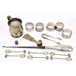 A mixed collection of hallmarked silver items to include napkin rings, a silver handled button hook,