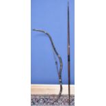 A Mongolian bow, length approx. 150cm, and a further straight shafted bow, length 182cm (2)