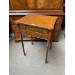 An Edwardian style mahogany small side table with inlaid top over two small drawers with brass