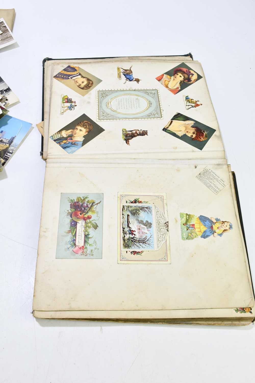 A late 19th/early 20th century scrapbook album containing various postcards and images, together - Image 5 of 6