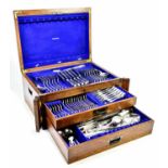 A silver plated King's pattern part cutlery set, in an early 19th century golden oak case with