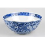 A 19th century Chinese blue and white porcelain footed bowl, painted with prunus flowers to the