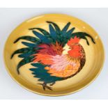 SALLY TUFFIN FOR DENNIS CHINAWORKS; a large circular bowl decorated with a cockerel, impressed