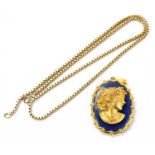 A 9ct gold necklace, weight 21.5g, with a yellow metal and blue glass oval pendant decorated with