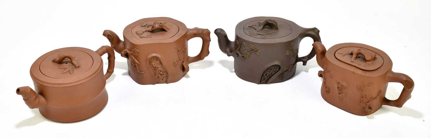 Four Chinese redware Yixing teapots and covers, with naturalistic detailing, the tallest 9.5cm (4)