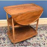 ERCOL; a light elm drop-leaf three tier dinner wagon/drinks trolley, height 75cm, width 74cm.