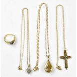 Three 9ct gold pendants and necklaces comprising a cross pendant and chain, a drop shaped locket and