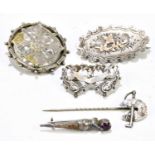 Two hallmarked silver brooches, together with two further brooches, stamped sterling and a white