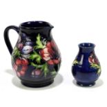 MOORCROFT; two pieces decorated in the 'Anemone' pattern, comprising a jug, height 15cm, and a squat
