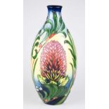 MOORCROFT; an ovoid trial vase decorated with flowers against a cream ground, height 31cm. Condition