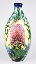 MOORCROFT; an ovoid trial vase decorated with flowers against a cream ground, height 31cm. Condition