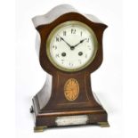 An Edwardian inlaid mahogany eight day mantel clock, the enamel dial with Roman numerals, with