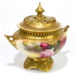 ROYAL WORCESTER; a blush ivory potpourri vase and cover, hand painted with sprays of roses, model