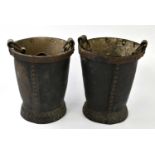 A pair of leather fire buckets, with brass studs, height 31cm.