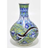 A Turkish Iznik vase, decorated with serpents, flowers and foliage against a blue ground,