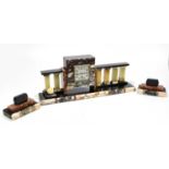 An Art Deco slate, marble and onyx three piece clock garniture, the clock of shaped rectangular form