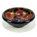 MOORCROFT; a 'Pomegranate' pattern bowl, with shaped rim, impressed marks and painted William