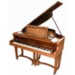 R. GÖRS & KALLMANN; a walnut cased boudoir grand piano, with gilt metal frame, on tapered square