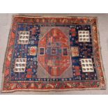 A Hamadan rug with red and blue ground set with various stylised motifs, 185 x 155cm.