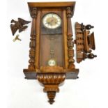 A Victorian walnut Vienna wall clock, the dial set with Roman numerals, approx 75cm.