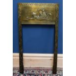 ATTRIBUTED TO JOHN PEARSON (1885-1910); an Arts and Crafts brass fire insert, relief decorated