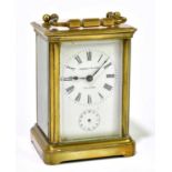 FRANKLIN & HARE, TAUNTON; a brass cased carriage clock, the dial set with Roman numerals, with