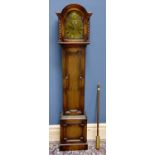 An early 20th century oak cased longcase clock of small proportions, the arch shaped hood