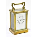 A brass carriage clock, the dial set with Roman numerals, height 11cm.